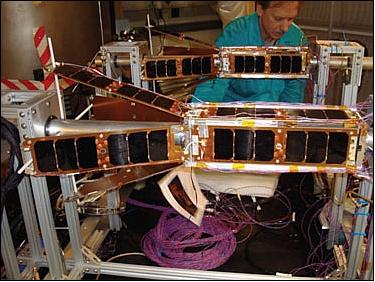 Figure 4: Photo of 2 QbX nanosatellites being prepared for TVAC (Thermal Vacuum) testing at NRL's Spacecraft Checkout Facility (image credit: NRL)