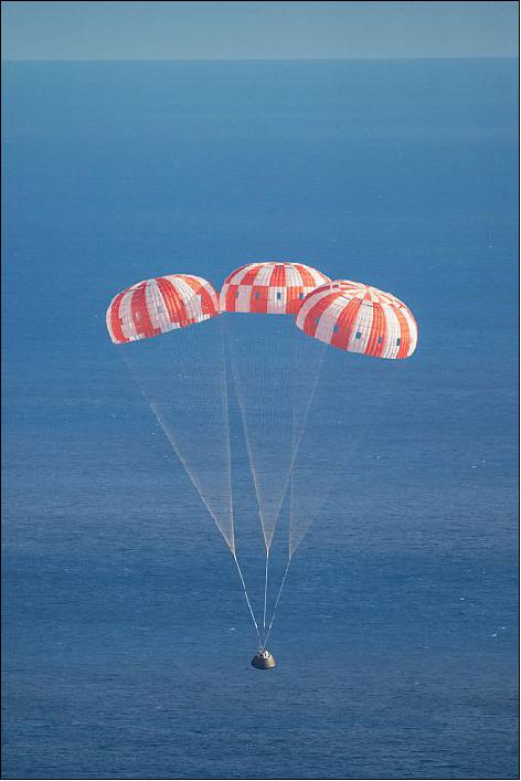 Figure 24: Photo of NASA's Orion spacecraft floating safely down toward the Pacific Ocean under its three massive main parachutes on Dec. 5, 2014 (image credit: NASA, James Blair)