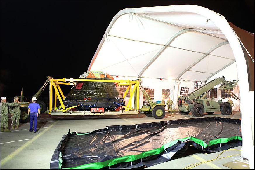 Figure 21: The Orion crew module is being moved into a covered structure at the Mole Pier at Naval Base San Diego in California where it will be prepared for return to NASA's Kennedy Space Center in Florida (image credit: Universe Today)