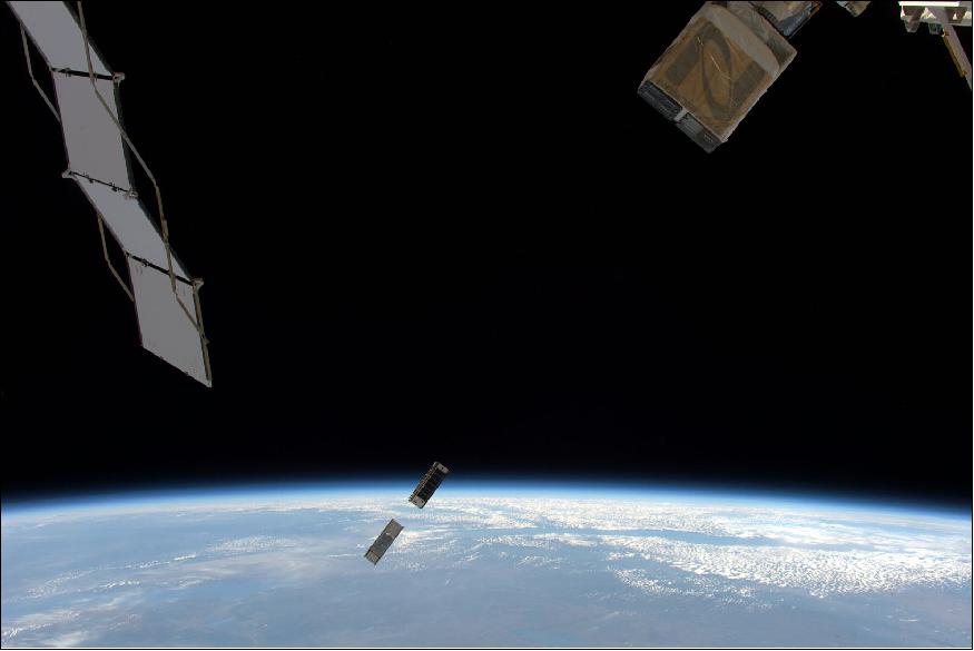 Figure 5: Astronaut Tim Peake on board the International Space Station captured this image of a CubeSat deployment on May 16, 2016. The top-most nanosatellite is CADRE of the University of Michigan. The CADRE mission is a space weather investigation that will improve our understanding of the dynamics of the upper layers of our atmosphere: the thermosphere and ionosphere. — The bottom-most CubeSat is the NASA-funded MinXSS CubeSat, which observes soft X-rays from the sun—such X-rays can disturb the ionosphere and thereby hamper radio and GPS signals (image credit: ESA, NASA)