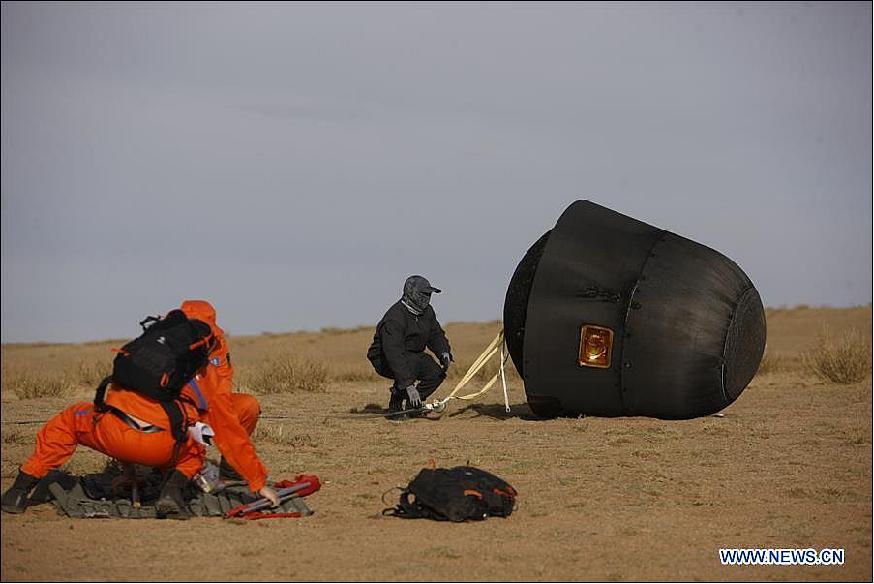 Figure 3: Recovery personnel are working at the landing site of the reentry capsule of China's first retrievable microgravity satellite SJ-10 in Siziwang Banner, north China's Inner Mongolia Autonomous Region, April 18, 2016 (image credit: Xinhua)