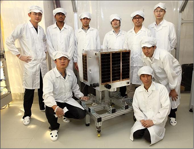 Figure 3: Young engineers with their Hodoyoshi-1 microsatellite (image credit: Axelspace)