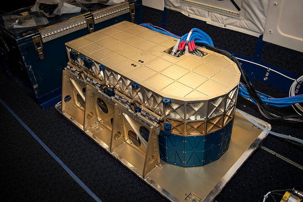 Figure 12: The HALO instrument head, which houses the lidar instrument, is installed onto the DC-8 airborne science laboratory at NASA Armstrong Flight Research Center in Edwards, California. The gold and blue casing holds the laser, optics, detectors, and electronics, which are at the heart of the lidar (image credit: NASA /Lauren Hughes)