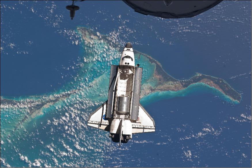 Figure 85: Space shuttle Atlantis is photographed from the International Space Station as it flies over the Bahamas prior to docking with the station. The Raffaello MPLM can be seen inside the shuttle's cargo bay (image credit: NASA)
