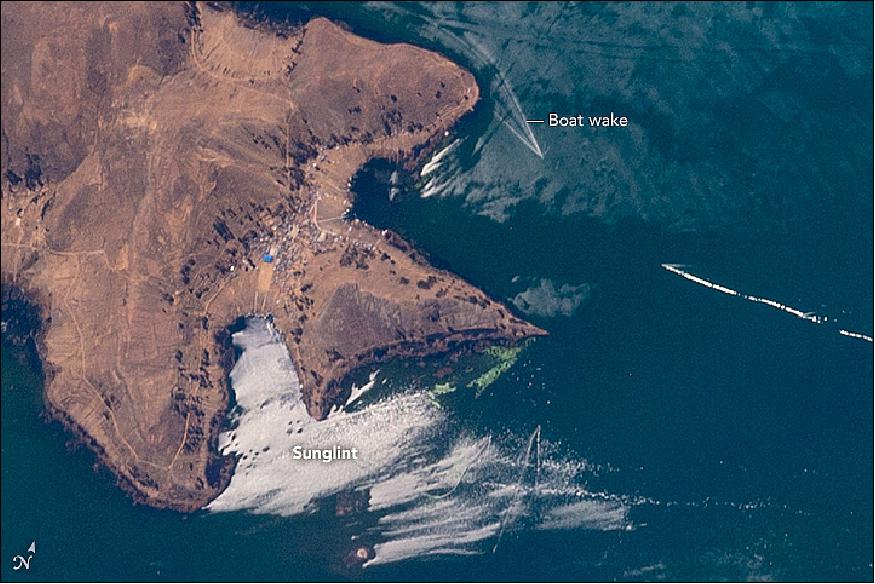 Figure 73: The close-up image, acquired on Sept. 10, 2016, shows a cluster of V-shaped wakes of boat traffic going to and from a small port on the island (image credit: NASA Earth Observatory, caption by M. Justin Wilkinson)