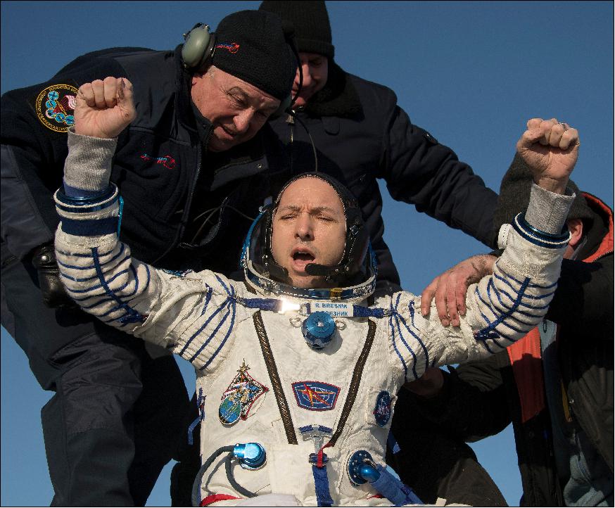 Figure 5: NASA astronaut Randy Bresnik is being helped by ground personnel after his landing in Kazakhstan (image credit: NASA TV)