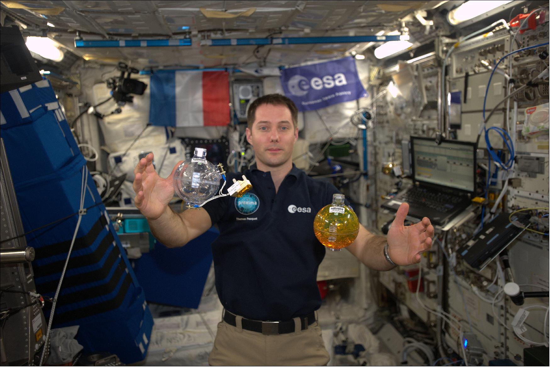 Figure 88: ESA astronaut Thomas Pesquet works on the Fluidics experiment inside the Space Station's European Columbus laboratory. - Posting on social media, Thomas wrote: "The spheres for the Fluidics experiment. One liquid is to help get every drop of fuel out of satellite fuel-tanks, the other liquid is to understand surface turbulence in liquids. By looking at surface turbulence without gravity interfering researchers can single out what influences behavior that forms ripples. This could help us better understand ocean currents and wave formation on Earth"(image credit: ESA/NASA)