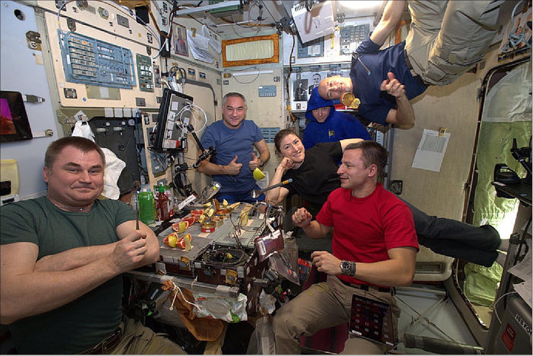 Figure 51: ESA astronaut Luca Parmitano shares a light dinner with his Expedition 60 crewmates on the International Space Station. Luca posted this image to social media during his Beyond mission with the caption: Among friends for a light dinner ... so light that everything flies (image credit: ESA7NASA)