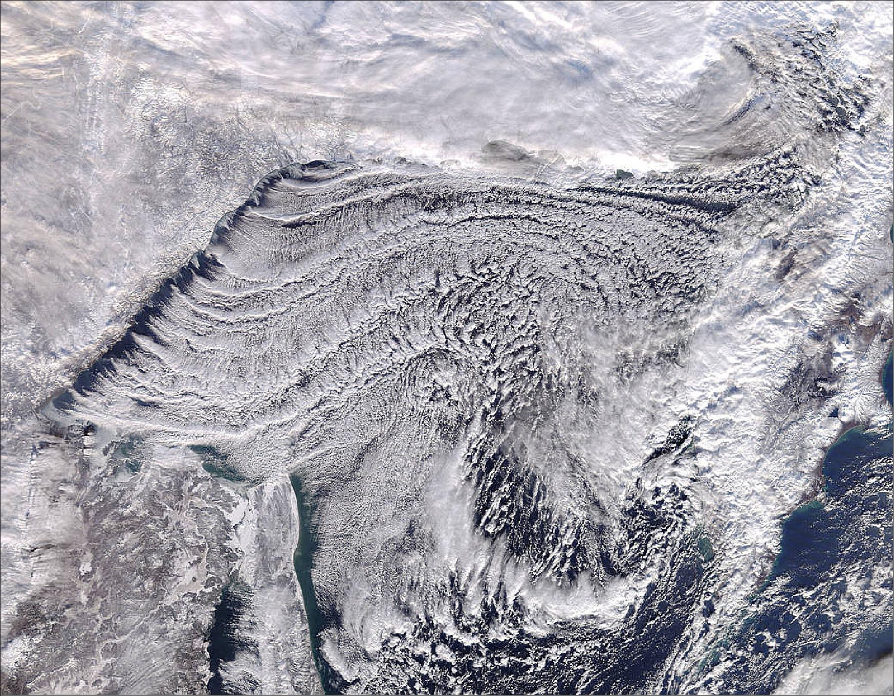 Figure 53: MODIS on Terra captured this true-color image of a stunning cloud formation scene over the Sea of Okhotsk on 25 November, 2017 (image credit: Jeff Schmaltz, MODIS Land Rapid Response Team, NASA/GSFC)