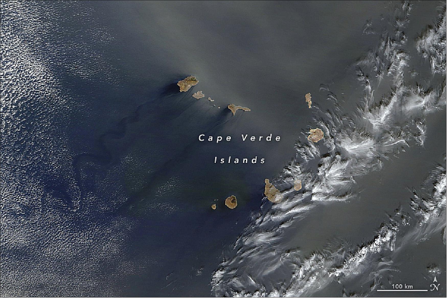 Figure 36: MODIS image of Saharan dust, acquired on 22 Jan. 2018, bathing the Cape Verde islands - resulting in wakes and vortices on the leeward side of the islands (image credit: NASA Earth Observatory, images by Joshua Stevens and Jeff Schmaltz, using MODIS data from LANCE/EOSDIS Rapid Response. Story by Mike Carlowicz and Holli Riebeek)