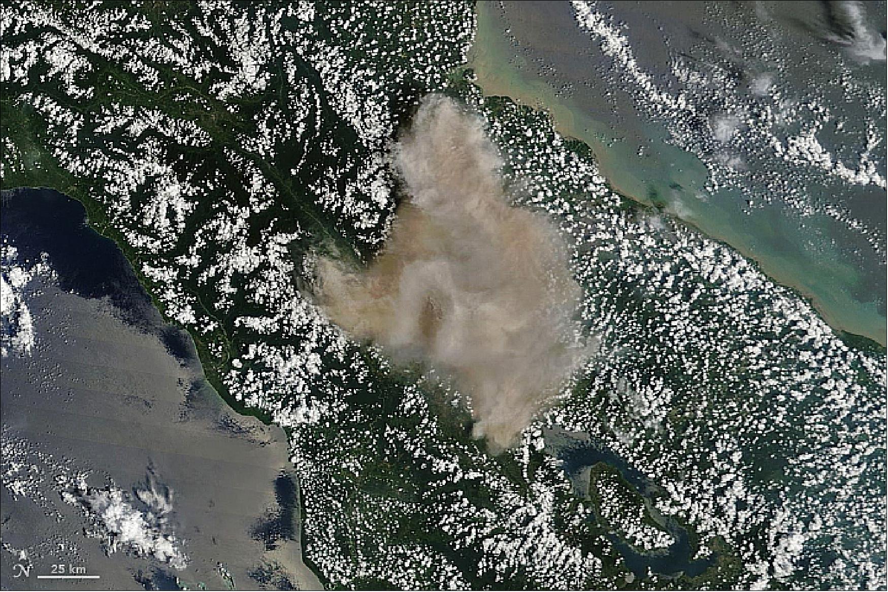 Figure 33: MODIS image on Terra, acquired on 19 Feb. 2018, showing the massive smoke-and-ash column of Mount Sinabung on the island of Sumatra (image credit: NASA Earth Observatory, images by Joshua Stevens, using MODIS data from LANCE/EOSDIS Rapid Response, Story by Mike Carlowicz)
