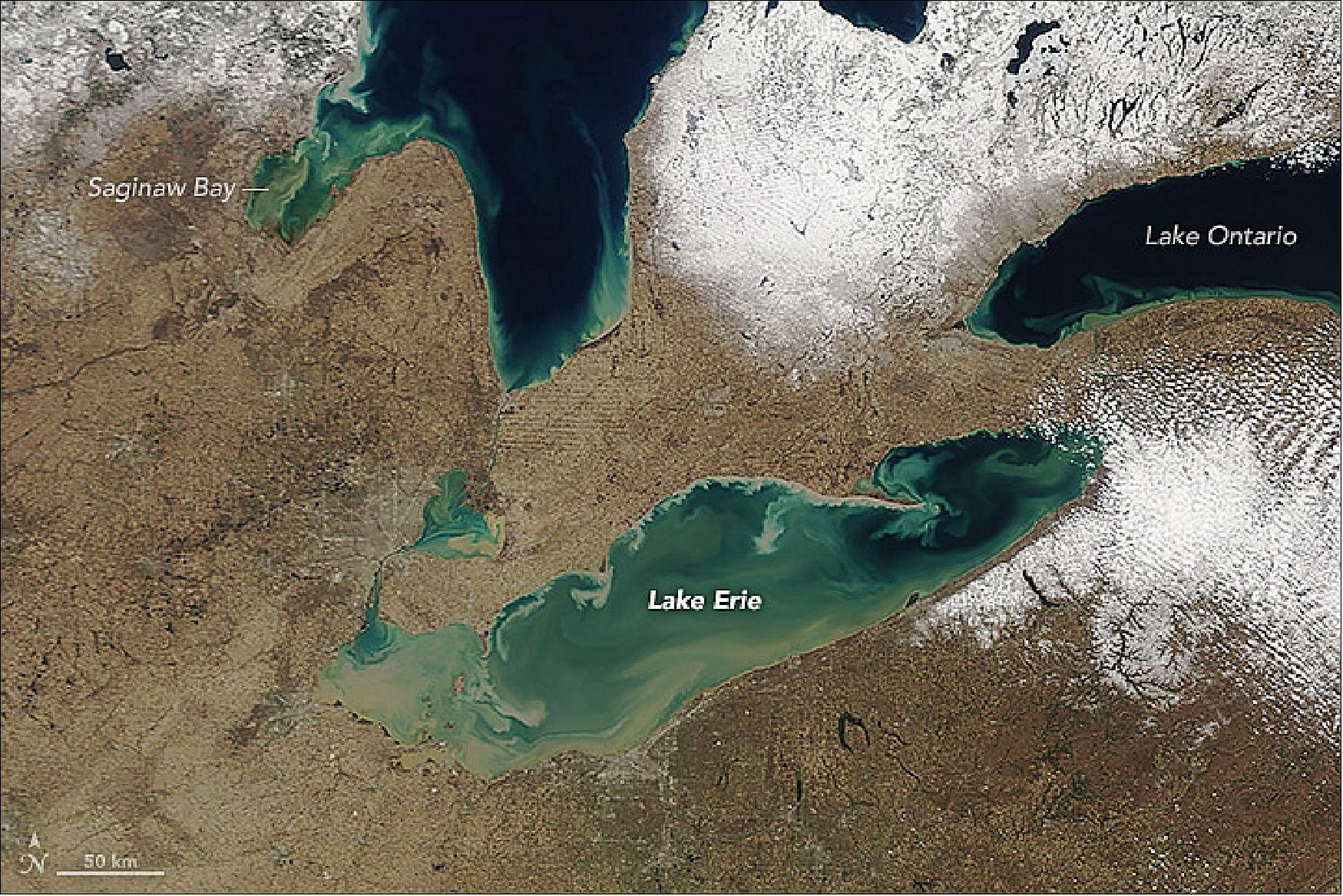 Figure 27: MODIS on NASA's Terra satellite captured this image on April 20, 2018. After the storm, bloated rivers and streams dumped sediment-rich water into the lakes. Brisk spring winds combined with lake currents to send tendrils of mud and other debris swirling into deeper, bluer waters (image credit: NASA Earth Observatory, image by Adam Voiland, using MODIS data from LANCE/EOSDIS Rapid Response, story by Adam Voiland)