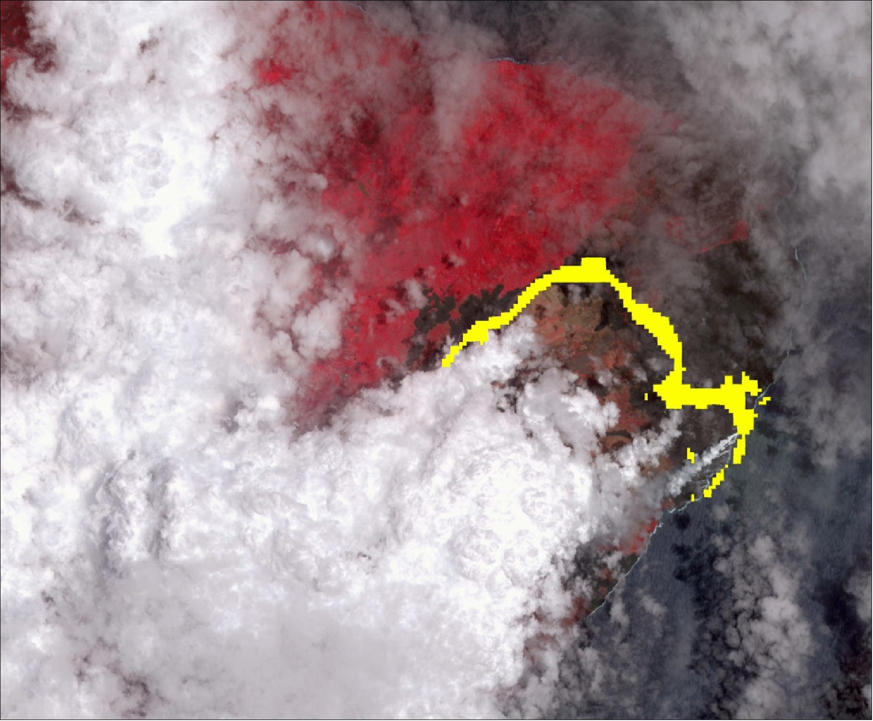 Figure 18: In this image, vegetation is displayed in red, clouds are white and the hot lava flows, detected by ASTER's thermal infrared channels, are overlaid in yellow. The image covers an area of 15.3 x 18.6 kilometers (image credit: NASA/METI/AIST/Japan Space Systems, and U.S./Japan ASTER Science Team)