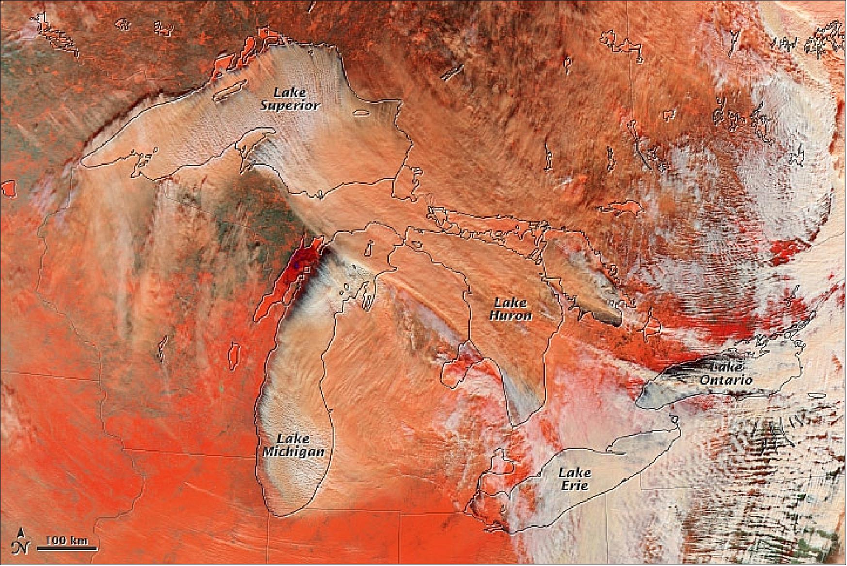 Figure 110: A false color image of MODIS on Terra acquired on January 6, 2014which helps to illustrate the difference between snow (bright orange), water clouds (white), and mixed clouds (peach), image credit: NASA