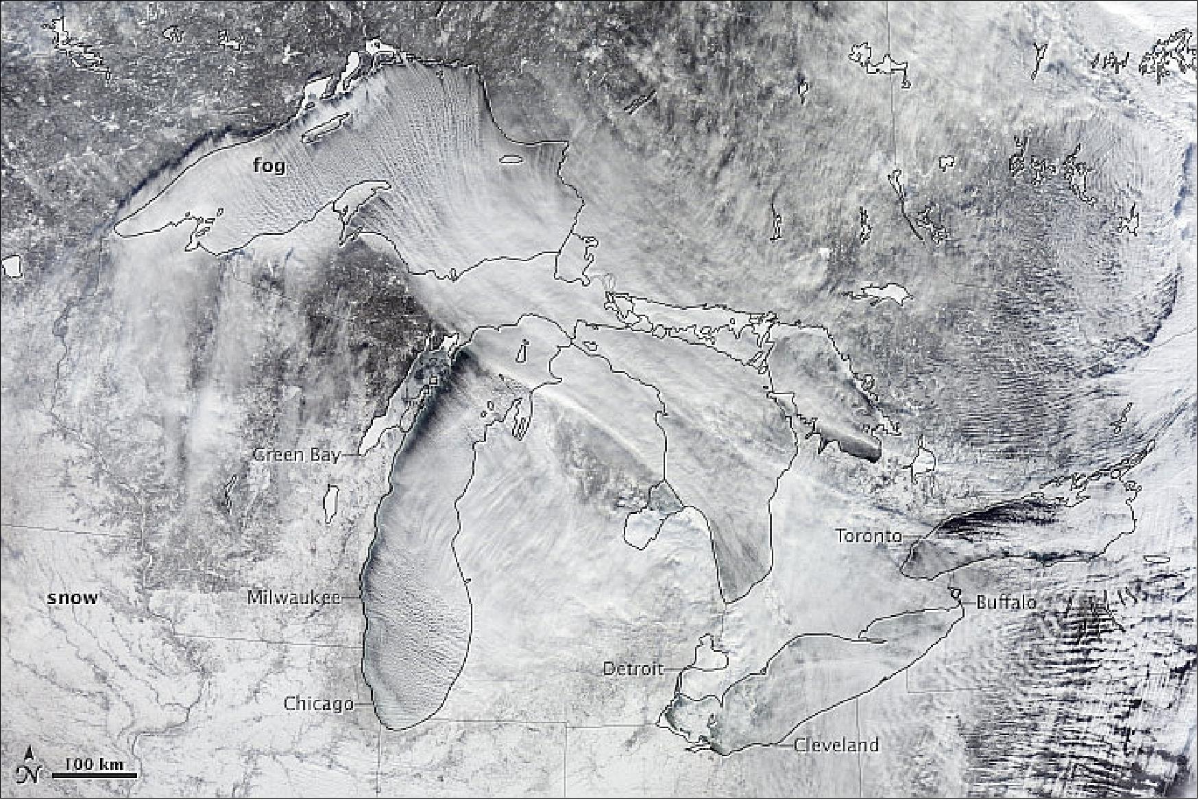 Figure 109: Natural color image of MODIS on Terra captured on January 6, 2013 showing fog forming over the lakes and streaming southeast with the wind (image credit: NASA)