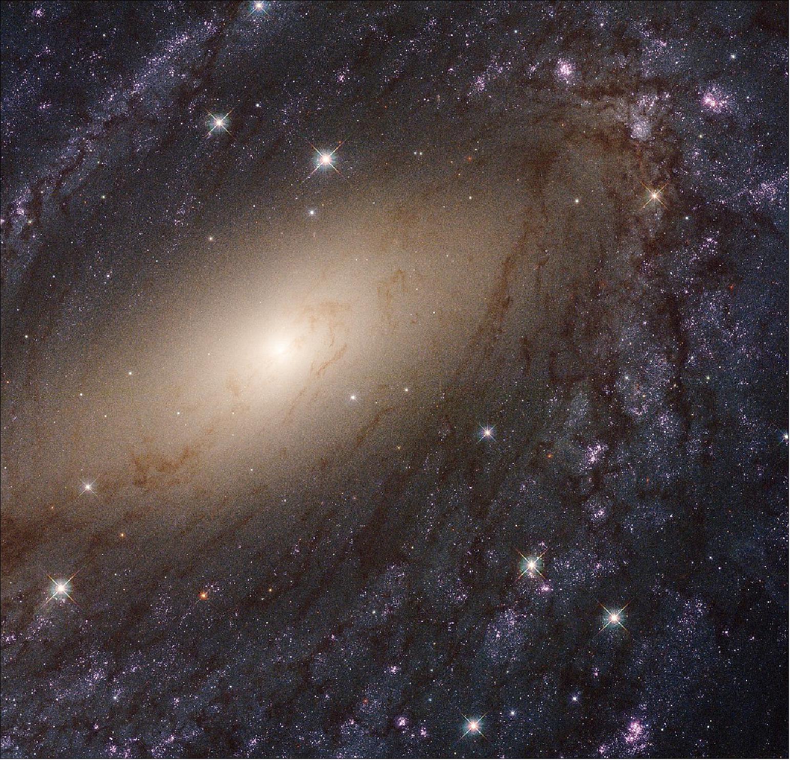 Figure 36: The glowing spiral arms of NGC 6744. This image shows the galaxy NGC 6744, about 30 million light-years away. It is one of 50 galaxies observed as part of the Hubble Space Telescope’s Legacy ExtraGalactic UV Survey (LEGUS), the sharpest, most comprehensive ultraviolet-light survey of star-forming galaxies in the nearby Universe, offering an extensive resource for understanding the complexities of star formation and galaxy evolution. The image is a composite using both ultraviolet light and visible light, gathered with Hubble’s Wide Field Camera 3 and Advanced Camera for Surveys (image credit: NASA, ESA, and the LEGUS team)
