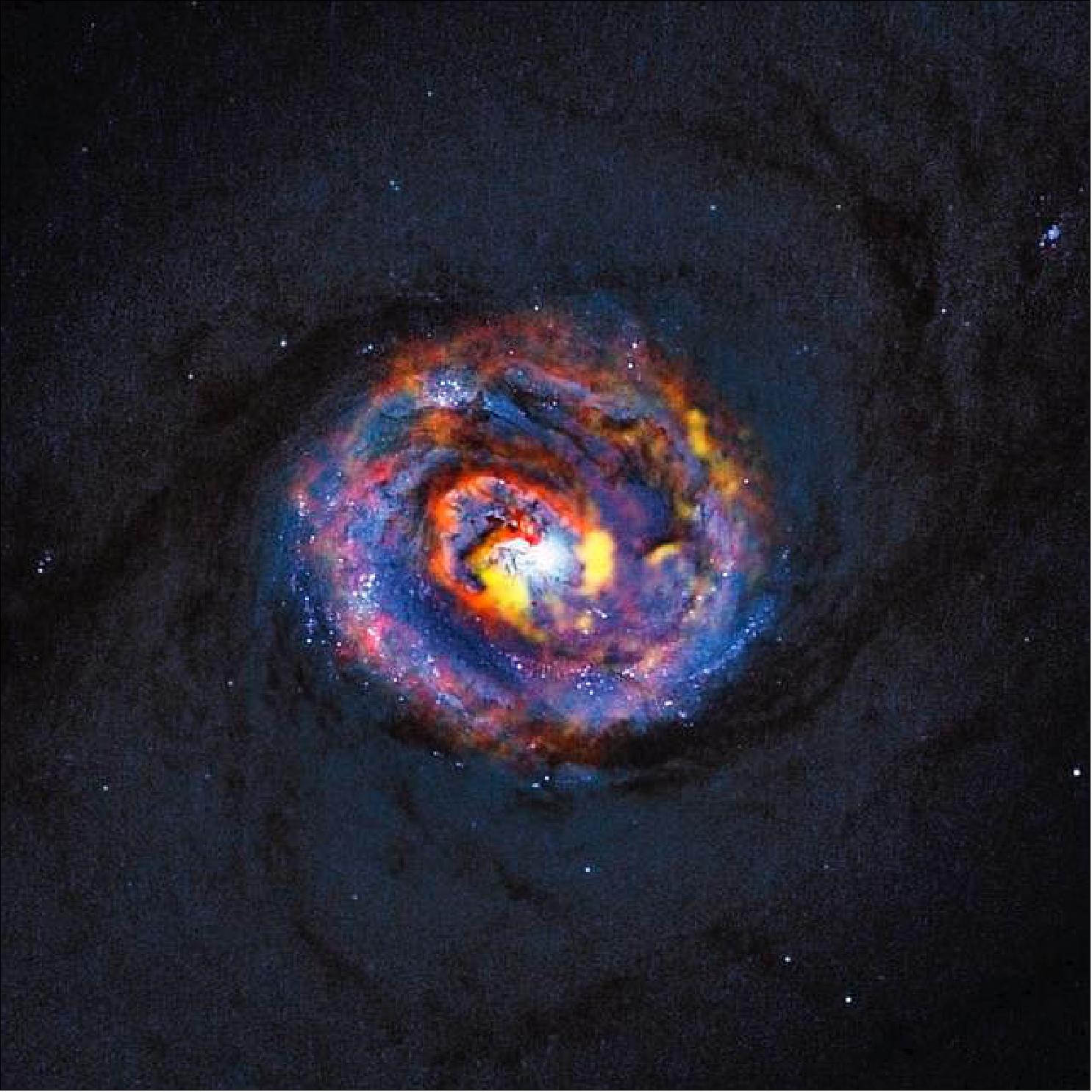 Figure 60: Composite view of the galaxy NGC 1433 from ALMA and Hubble. This detailed view shows the central parts of the nearby active galaxy NGC 1433. The dim blue background image, showing the central dust lanes of this galaxy, comes from the NASA/ESA Hubble Space Telescope. The colored structures near the center are from recent ALMA observations that have revealed a spiral shape, as well as an unexpected outflow, for the first time (image credit: ALMA, ESO/NAOJ/NRAO)/NASA/ESA, F. Combes)