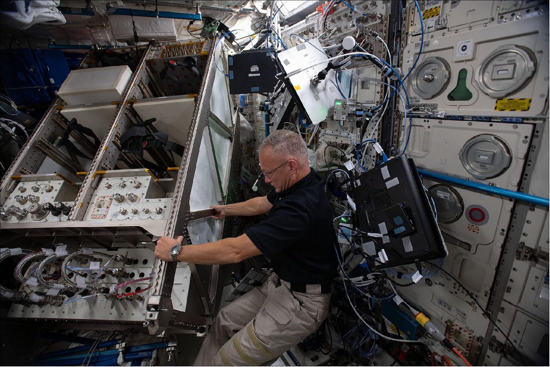 Figure 12: NASA astronauts Bob Behnken and Doug Hurley maneuvered the fridge-sized European Drawer Rack Mark 2(EDR2) to its new position. EDR2 is designed to run in parallel with the original European Drawer Rack, providing even greater opportunities for science in space. A feat that would be much more difficult on Earth, installing EDR-2 in weightlessness was not exactly physically taxing, but required careful maneuvering in the limited space. Watch a video of the installation (image credit: ESA/NASA)