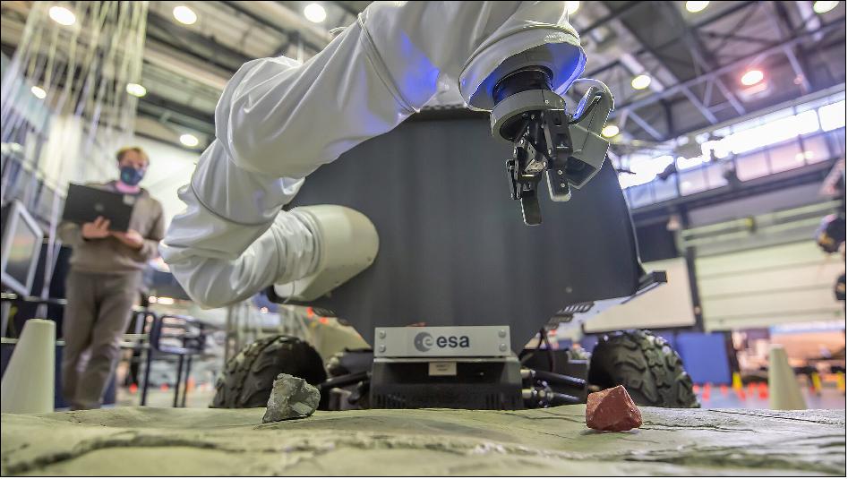Figure 3: Interact rover picking up geological sample. A controller in Germany operated ESA’s gripper-equipped Interact rover around a simulated moonscape at the Agency’s technical heart in the Netherlands, to practice retrieving geological samples (image credit: ESA– SJM Photography)