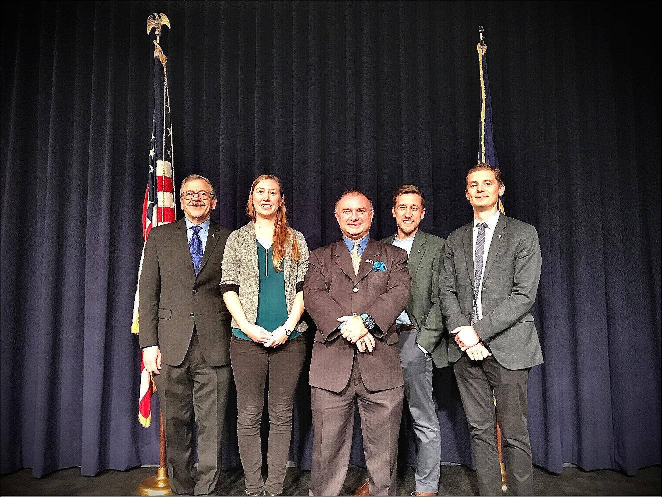 Figure 13: The Goddard PNT policy team receiving a 2019 Agency Honor Award for their advocacy of NASA’s interests in GNSS. From right to left: Frank Bauer, Jenny Donaldson, J. J. Miller, Ben Ashman, and Joel Parker. Not pictured, Lauren Schlenker (image credit: NASA)