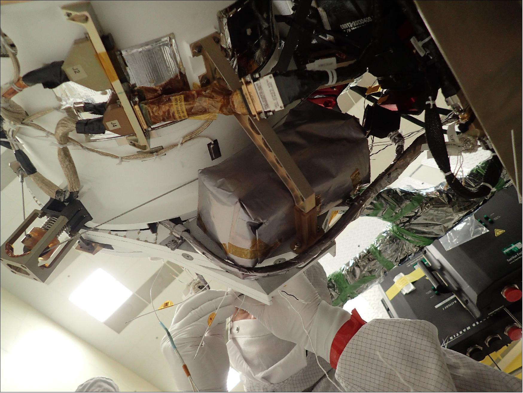 Figure 35: A technician works to install GMAG on the GOES-T spacecraft (image credit: Lockheed Martin)