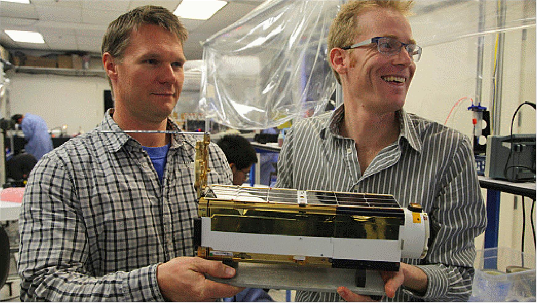 Figure 1: Photo of the proud developers and a close-up view of a Flock 1 nanosatellite (image credit: Planet Labs) 4)