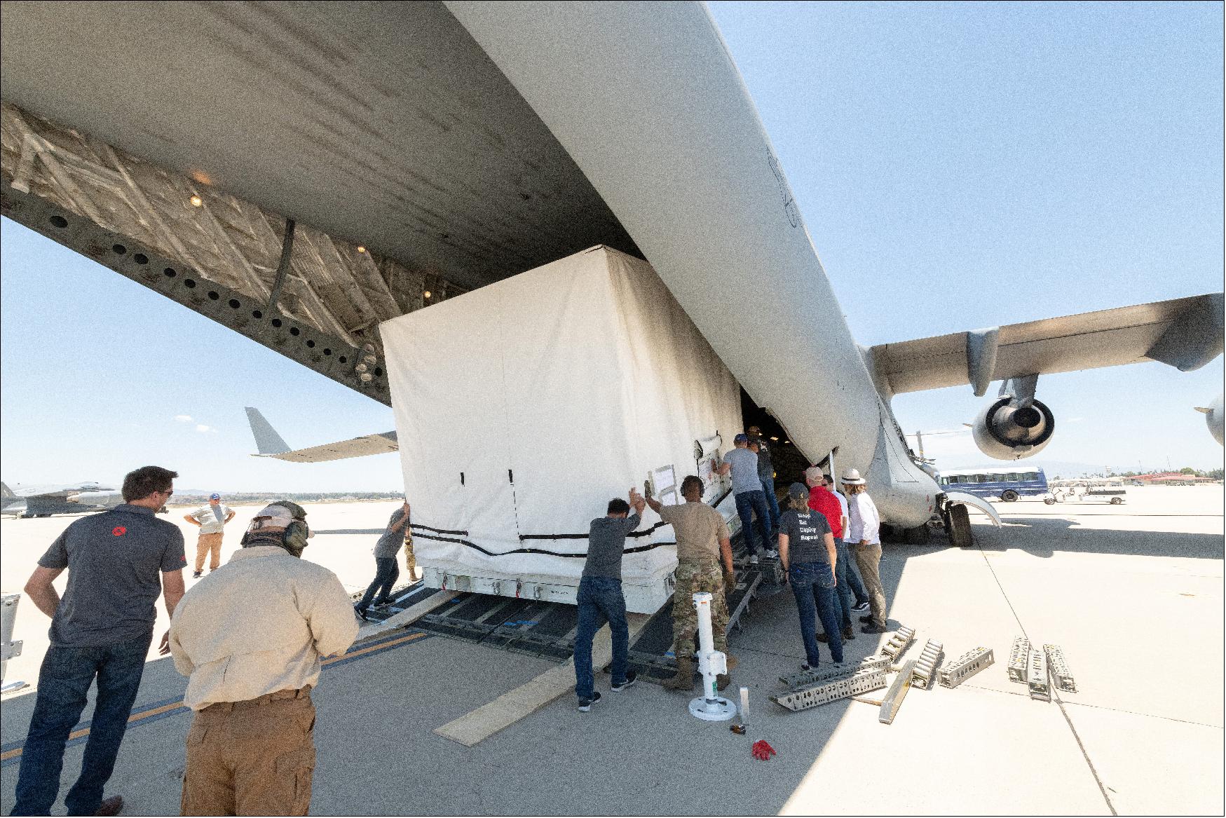 Figure 46: Teams from NASA/JPL and the March Air Reserve Base in Riverside County, California, loaded the scientific payload for the SWOT Earth-observing satellite into a C-17 airplane on June 27. The hardware is headed to a clean room facility near Cannes, France (image Credit: NASA/JPL-Caltech)